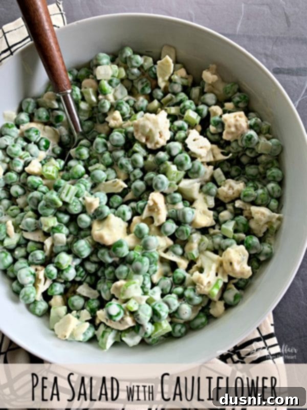 Close-up of Pea Salad with Cauliflower in a white bowl, ready to be served.