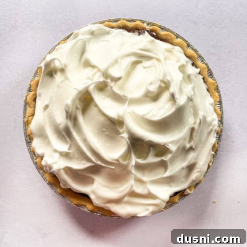 Whipping egg whites for meringue in a stand mixer.