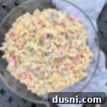 overhead of pasta salad with spam in a clear bowl