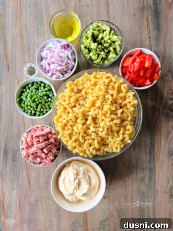 A whole, unopened can of Spam Classic sits next to a cutting board with diced Spam cubes, ready for the pasta salad.