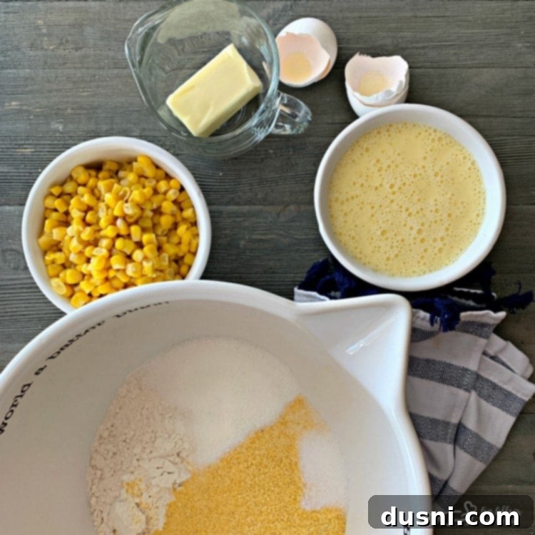 Ingredients for corn fritters mixed in a bowl, showing the batter consistency.