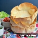 Crispy Air Fryer Taco Salad Bowls 12 Air Fryer Taco Salad Bowls stacked close up