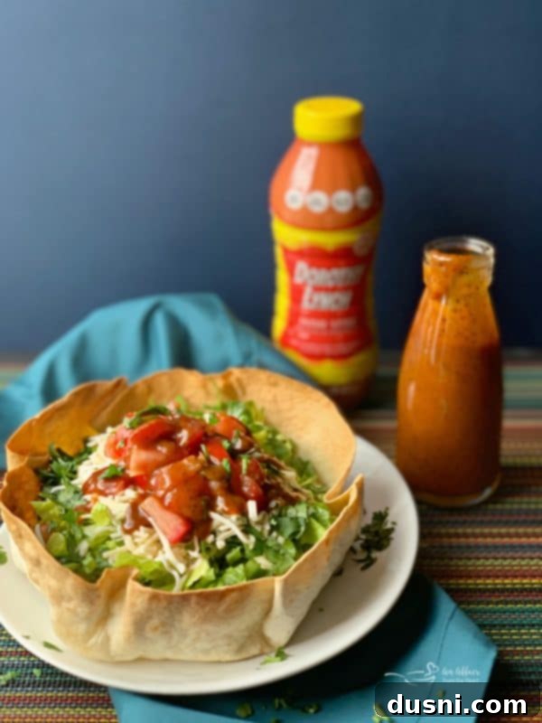 Another appealing vertical shot of a taco salad featuring Dorothy Lynch Taco Sauce