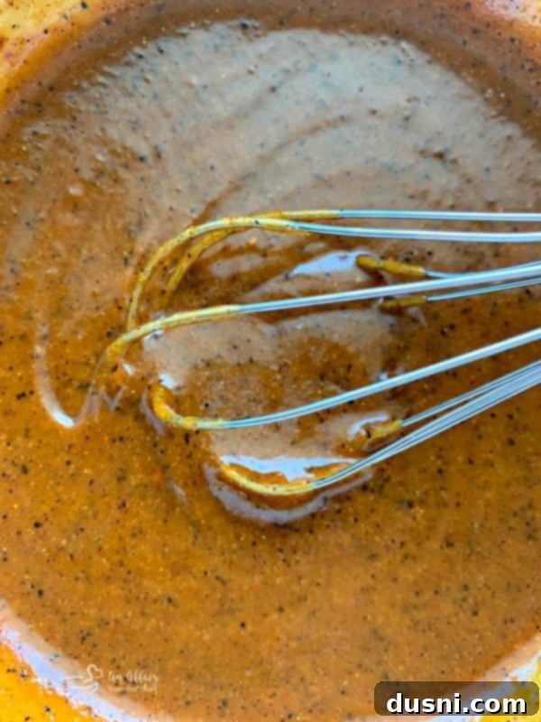 Whisking ingredients to create the Homemade Dorothy Lynch Taco Sauce