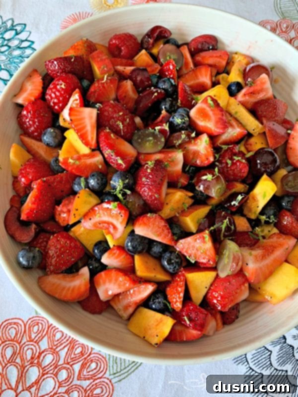 Summer Fruit Salad with Honey Lime Poppy Seed Dressing with extra lime zest