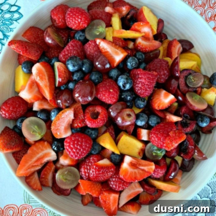 Square image of Summer Fruit Salad with Honey Lime Poppy Seed Dressing