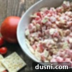 close up of Tomato Cracker Salad in a white bowl