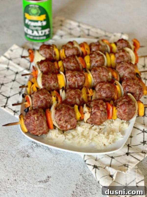 Sizzling Brat & Krautball Skewers 11 Serving of Grilled Bratwurst & Kraut Meatball Kabobs on a bed of Frank's Kraut