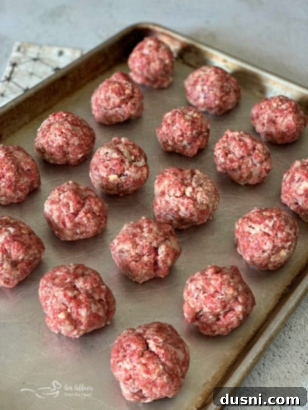 Sizzling Brat & Krautball Skewers 8 Hand forming a bratwurst and kraut meatball