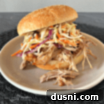 Slow Cooker Pulled Pork with Dorothy Lynch Coleslaw 21 Close up of Crock Pot Pulled Pork with Dorothy Lynch Coleslaw on a white plate