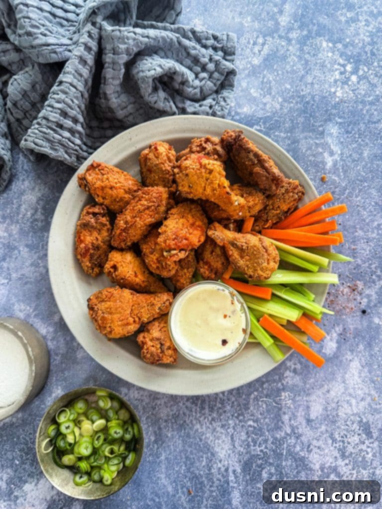Air Fryer Copy Cat Hooters Wings on a plate with celery and ranch