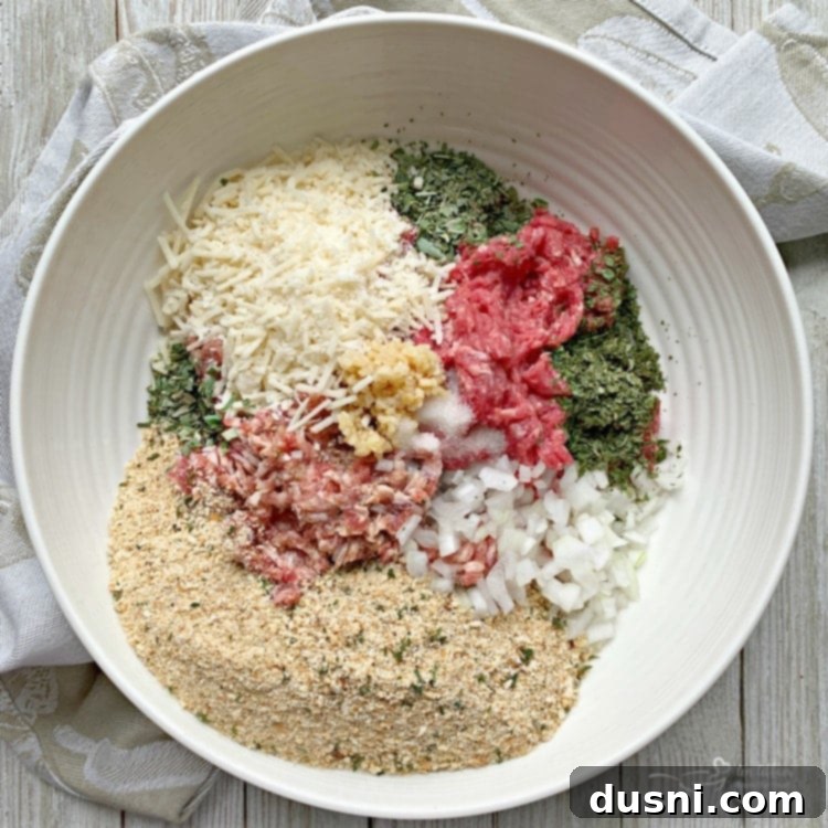 Ingredients for Italian Meatballs combined in a large bowl