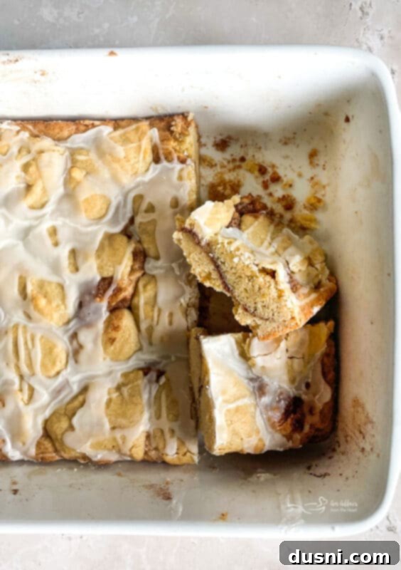 Glazed Snickerdoodle Bars 15 A close-up of a single Iced Snickerdoodle Bar, showing the textured top with glaze and cinnamon sugar.