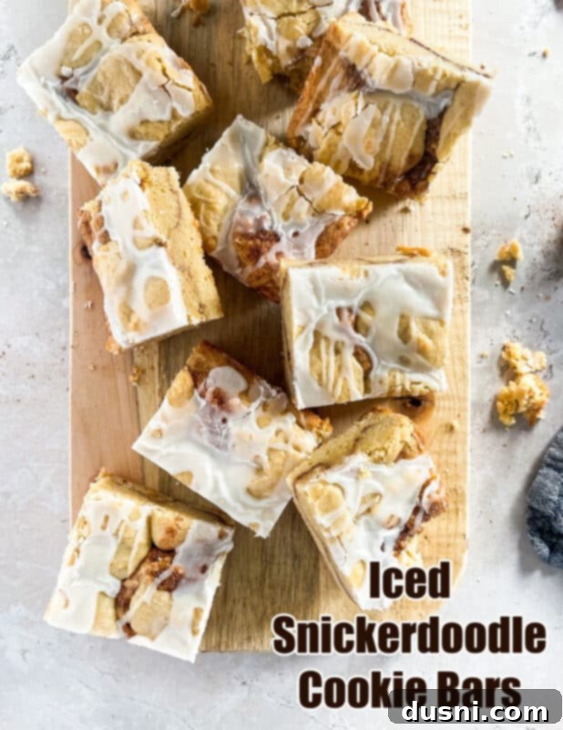 Glazed Snickerdoodle Bars 18 A stunning hero shot of Iced Snickerdoodle Cookie Bars, beautifully plated and ready to serve.