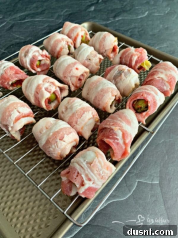 Bacon Blanketed Brussels Sprouts 9 Bacon Wrapped Hot Brussels Sprouts on a baking sheet