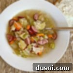 Kapusniak Polish Sauerkraut Soup 14 Overhead of Polish Sauerkraut Soup - Kapusniak in a white bowl