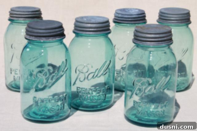 Mason jars filled with homemade sauerkraut during the fermentation process