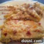 Comforting Creamy Chicken and Bacon Pasta Bake 2 creamy baked chicken pasta with bacon on a white plate with text "creamy baked chicken pasta with bacon"