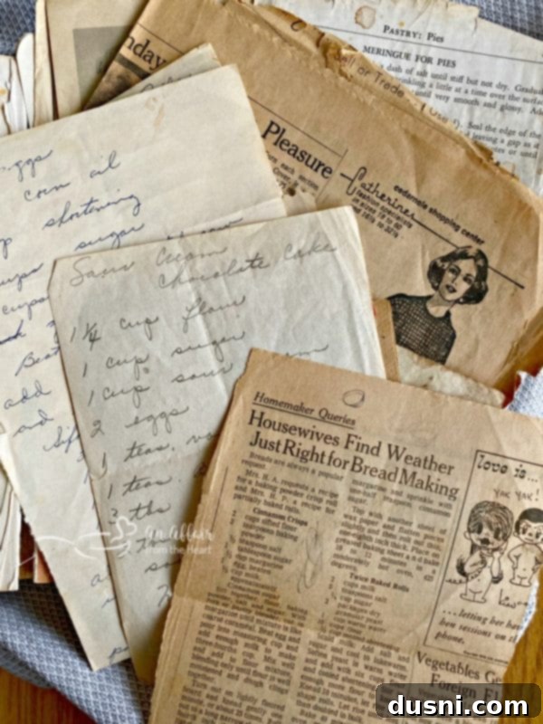 Inside view of Grandma Martin's handwritten recipe cookbook with notes and clippings