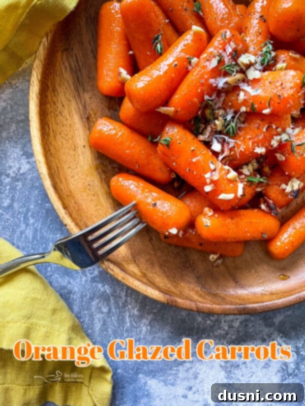 Sunshine Glazed Carrots 12 Large serving of orange glazed carrots in a bowl, ready to be served