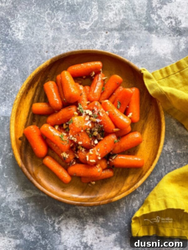 Sunshine Glazed Carrots 9 Close-up of orange glazed carrots with goat cheese and herbs