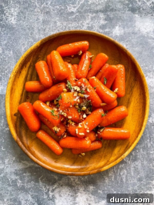 Sunshine Glazed Carrots 10 Cauliflower and Carrot Gratin in a baking dish with a wooden spoon
