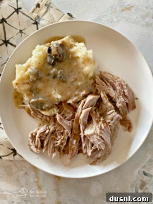 Fuggedaboutit Pork Roast with mashed potatoes and gravy plated