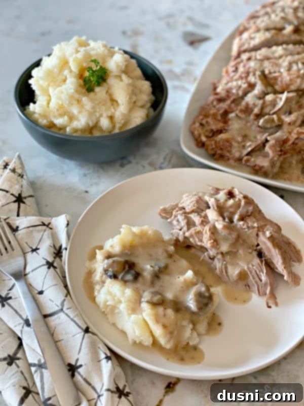 Fuggedaboutit Pork Roast served with creamy mashed potatoes