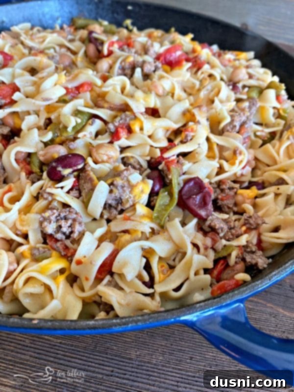 Finished Five Bean Ground Beef & Noodle Skillet Casserole with melted cheese