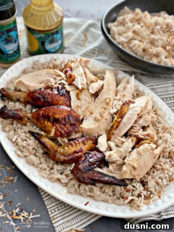Jamaican Jerk Glazed Chicken over Sweet Coconut Rice carved on platter