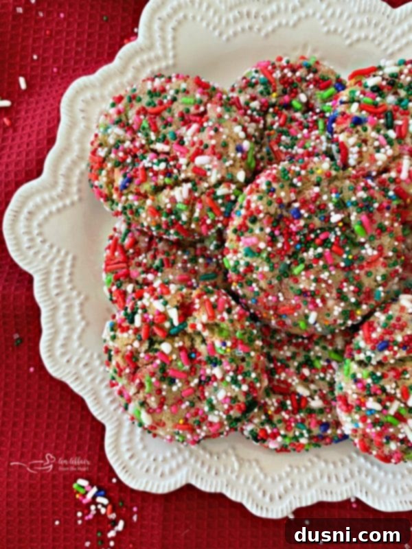 Festive Funfetti Sugar Cookies 2 Beautifully decorated Funfetti Sugar Cookies with red, green, and white sprinkles on a festive platter