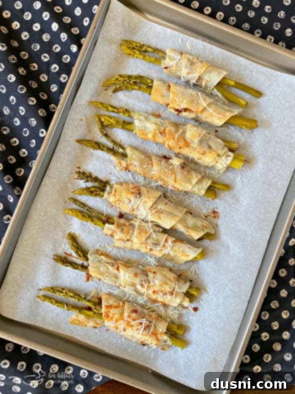 Bacon & Cheese Phyllo Wrapped Pickled Asparagus Baked on Cookie Sheet