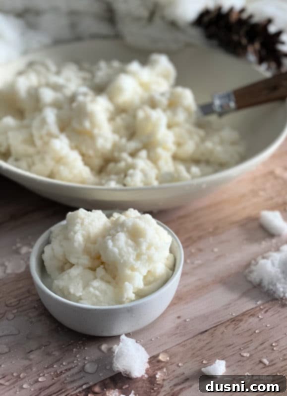 Snow Day Sweetness 3 A close-up of snow ice cream with a spoon, showing its creamy texture.