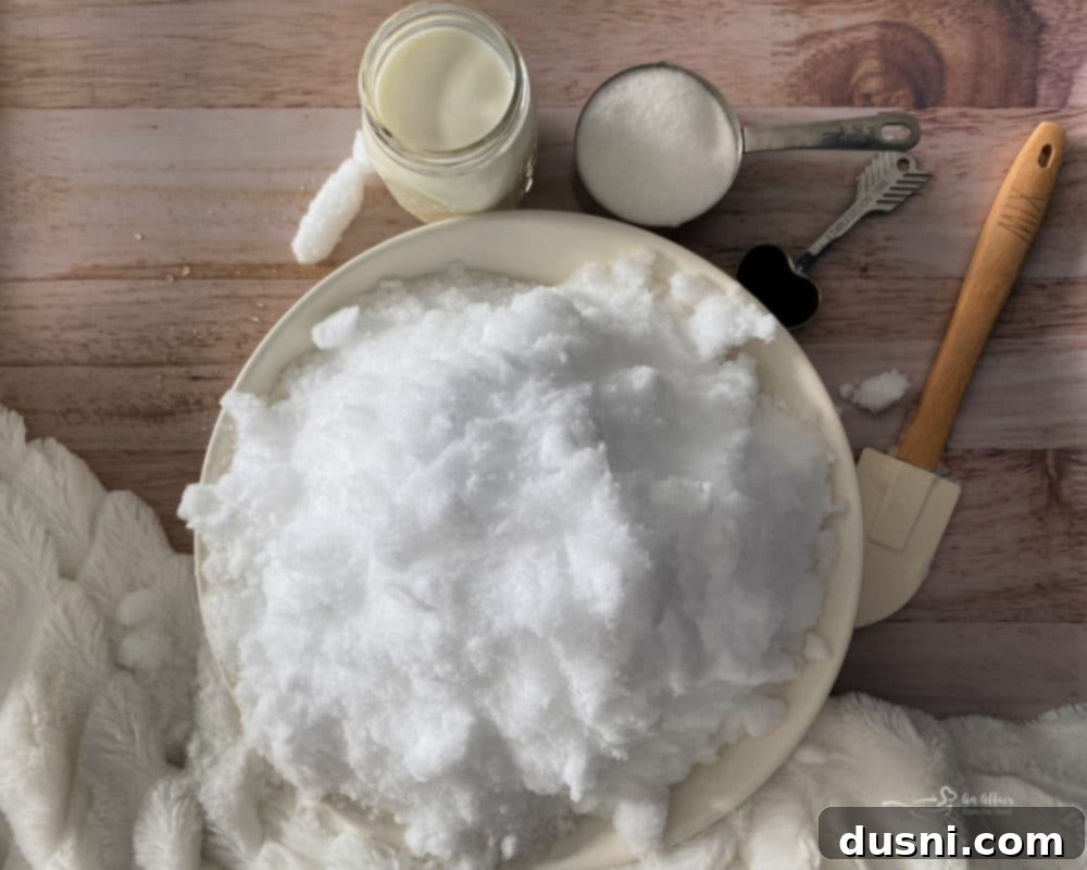 Ingredients for snow ice cream laid out: snow in a bowl, milk, sugar, and vanilla extract.