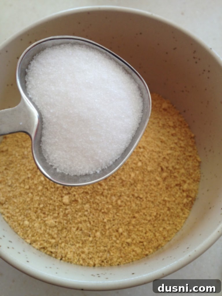 No Bake Lemon Raspberry Mini Cheesecakes 2 Close-up of a single lemon raspberry cheesecake in a glass bowl