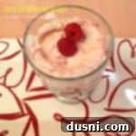 No Bake Lemon Raspberry Mini Cheesecakes 3 overhead of cheesecake in a glass with text "lemon raspberry cheesecakes"