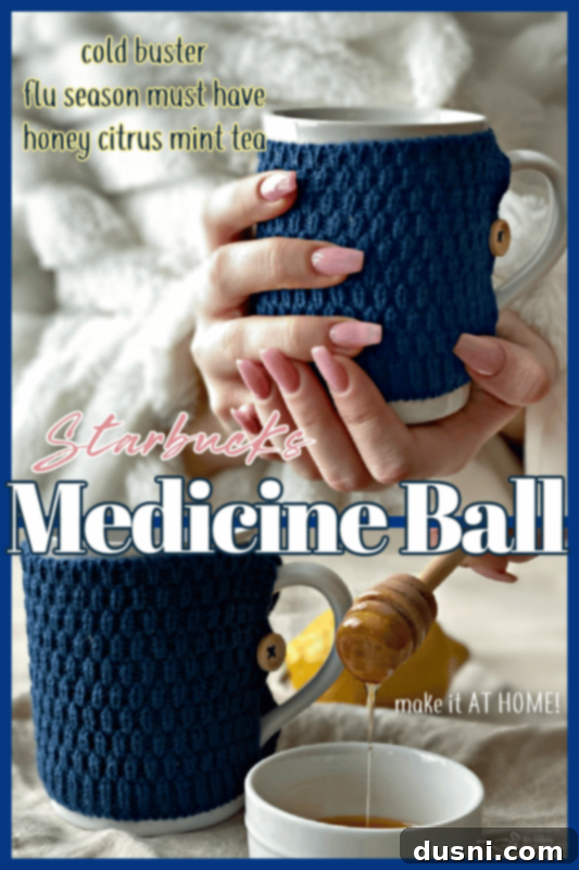 hands holding Starbucks copycat medicine ball tea in a mug