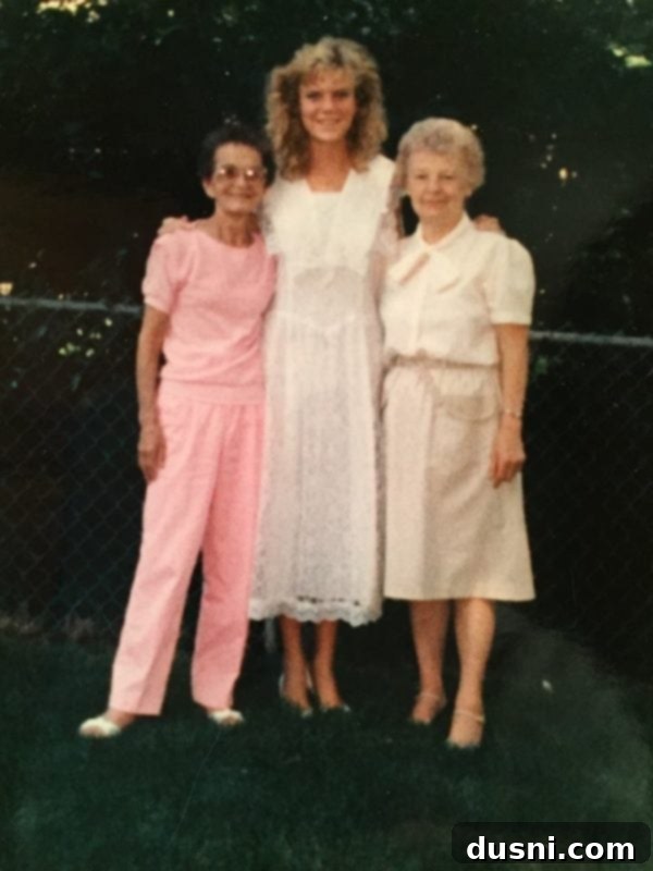 The author after high school graduation with both of her grandmothers, a precious moment celebrating family.