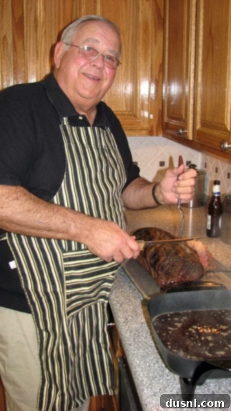 The author's father-in-law carving prime rib, a cherished family moment of shared meals.