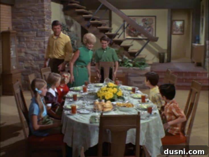 The Brady Bunch family at the dinner table, emphasizing the importance of shared meal times and family interaction.