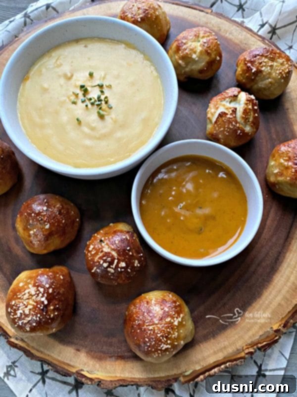 Golden Pretzel Sausage Bites with Zesty Cheese Sauce 2 Delicious Sausage Pretzel Bombs with Mustard Cheese Sauce, ideal appetizer recipe