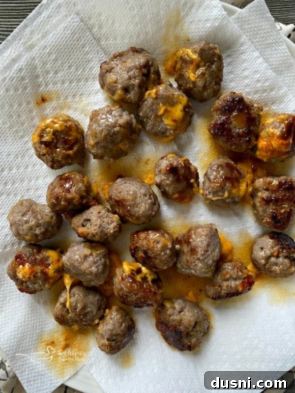Golden Pretzel Sausage Bites with Zesty Cheese Sauce 11 Pre-cooking Italian sausage meatballs for stuffed pretzel bombs