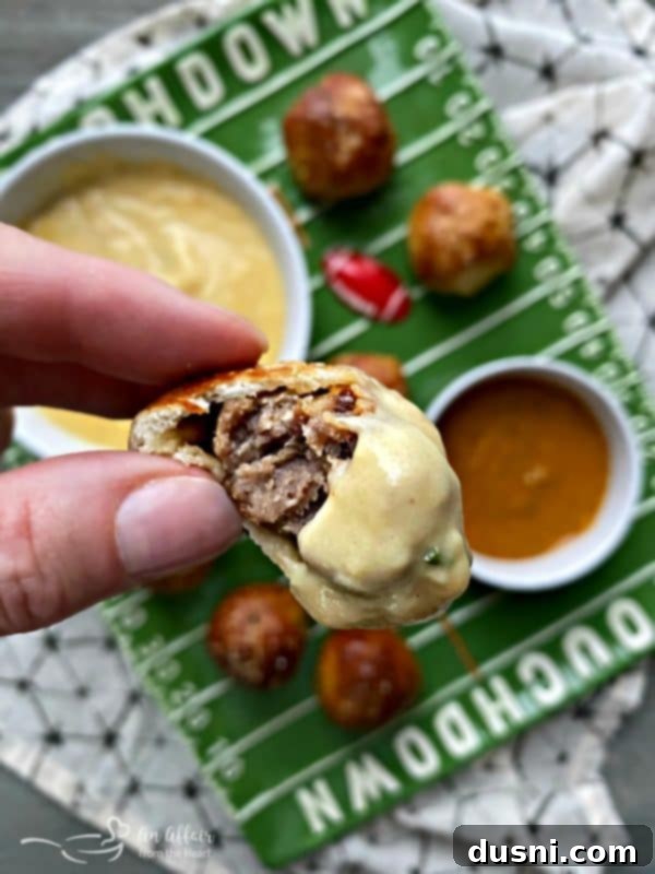 Golden Pretzel Sausage Bites with Zesty Cheese Sauce 16 Sausage Pretzel Bombs served hot with creamy Mustard Cheese Sauce for dipping