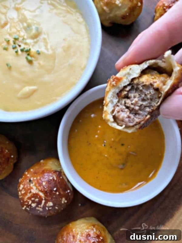 Golden Pretzel Sausage Bites with Zesty Cheese Sauce 17 Serving Sausage Pretzel Bombs with a side of Herbal Gatherings Mustard