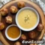 Golden Pretzel Sausage Bites with Zesty Cheese Sauce 21 Top view Appetizer recipe Sausage Pretzel Bombs with Mustard Cheese Sauce