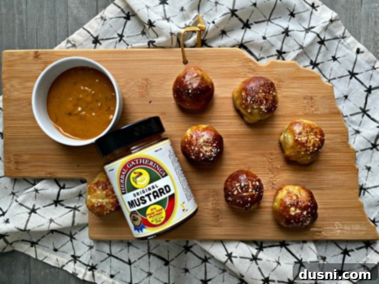 Golden Pretzel Sausage Bites with Zesty Cheese Sauce 8 Sausage Pretzel Bombs served with Herbal Gatherings Mustard from Nebraska