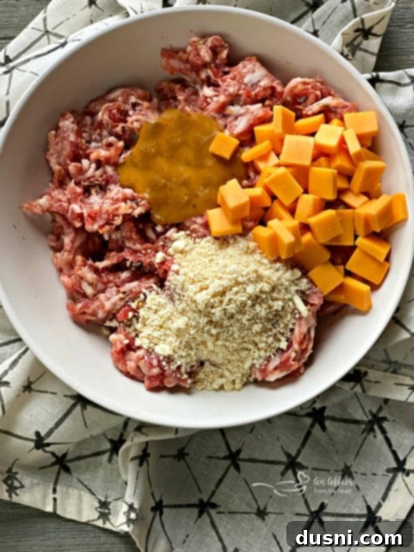 Golden Pretzel Sausage Bites with Zesty Cheese Sauce 9 Preparing the sausage mixture for Sausage Pretzel Bombs