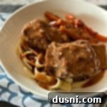 Tender Braised Beef Short Ribs with Red Eye Gravy 18 Braised Beef Short Ribs with Red Eye Gravy in a white bowl