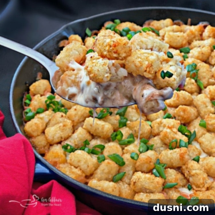Bold Sausage, Mushroom and Golden Tot Bake 2 Spicy Tater Tot Casserole with Sausage & Mushrooms spoonful
