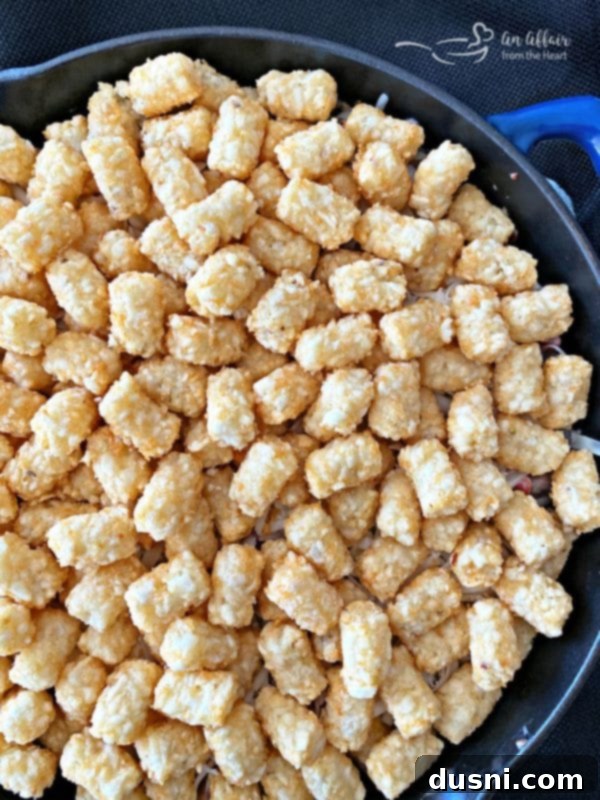 Bold Sausage, Mushroom and Golden Tot Bake 9 Spicy Tater Tot Casserole with Sausage & Mushrooms prep with tots